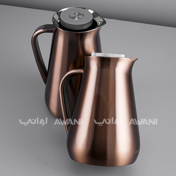 Two copper-colored coffee pots on a gray background.
