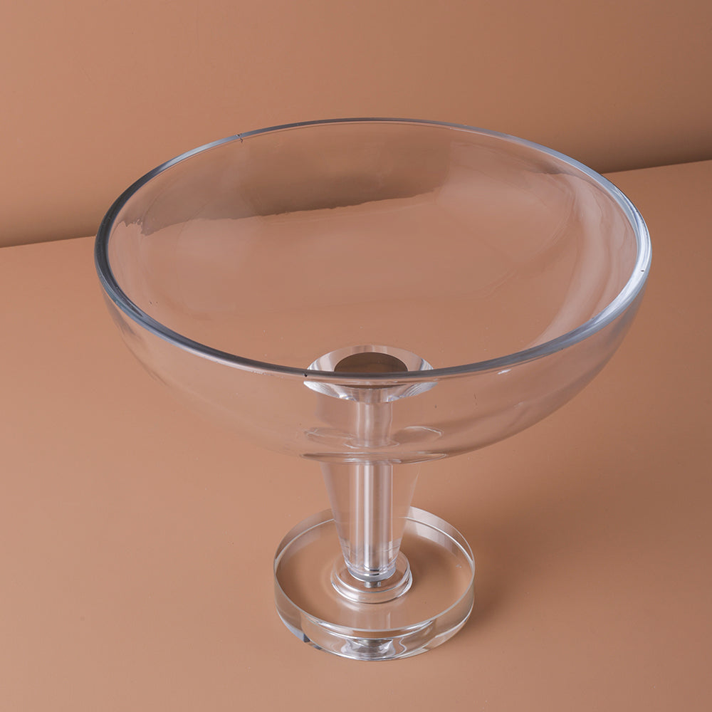 Clear glass bowl on a brown background